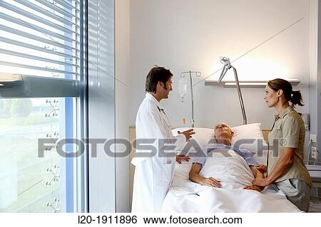 doctor attending to patient in hospital room, Onkologikoa Hospital, Oncology Institute, Case Center for prevention, diagnosis and treatment of cancer, Donostia, San Sebastian, Gipuzkoa, Basque Country, Spain View Large Photo Image Stock Photograph - doctor attending to patient in hospital room, Onkologikoa Hospital, Oncology Institute, Case Center for prevention, diagnosis and treatment of cancer, Donostia, San Sebastian, Gipuzkoa, Basque Country, Spain. Fotosearch