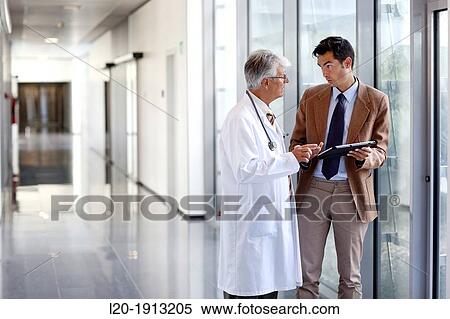 Doctor attending to seller, Corridor, Onkologikoa Hospital, Oncology Institute, Case Center for prevention, diagnosis and treatment of cancer, Donostia, San Sebastian, Gipuzkoa, Basque Country, Spain View Large Photo Image Stock Photography - Doctor attending to seller, Corridor, Onkologikoa Hospital, Oncology Institute, Case Center for prevention, diagnosis and treatment of cancer, Donostia, San Sebastian, Gipuzkoa, Basque Country, Spain. Fotosearch