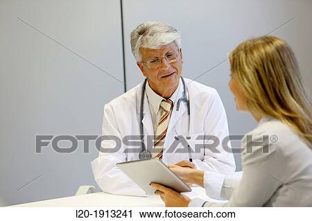 Doctor attending to seller, Tablet, Consulting room, Onkologikoa Hospital, Oncology Institute, Case Center for prevention, diagnosis and treatment of cancer, Donostia, San Sebastian, Gipuzkoa, Basque Country, Spain View Large Photo Image Stock Image - Doctor attending to seller, Tablet, Consulting room, Onkologikoa Hospital, Oncology Institute, Case Center for prevention, diagnosis and treatment of cancer, Donostia, San Sebastian, Gipuzkoa, Basque Country, Spain. Fotosearch