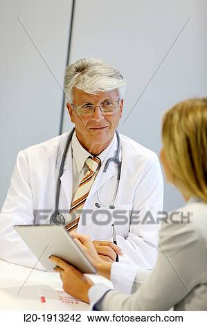 Doctor attending to seller, Tablet, Consulting room, Onkologikoa Hospital, Oncology Institute, Case Center for prevention, diagnosis and treatment of cancer, Donostia, San Sebastian, Gipuzkoa, Basque Country, Spain View Large Photo Image Stock Image - Doctor attending to seller, Tablet, Consulting room, Onkologikoa Hospital, Oncology Institute, Case Center for prevention, diagnosis and treatment of cancer, Donostia, San Sebastian, Gipuzkoa, Basque Country, Spain. Fotosearch