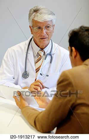Doctor attending to seller, Tablet, Consulting room, Onkologikoa Hospital, Oncology Institute, Case Center for prevention, diagnosis and treatment of cancer, Donostia, San Sebastian, Gipuzkoa, Basque Country, Spain View Large Photo Image Stock Photo - Doctor attending to seller, Tablet, Consulting room, Onkologikoa Hospital, Oncology Institute, Case Center for prevention, diagnosis and treatment of cancer, Donostia, San Sebastian, Gipuzkoa, Basque Country, Spain. Fotosearch