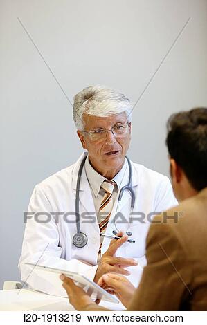 Doctor attending to seller, Tablet, Consulting room, Onkologikoa Hospital, Oncology Institute, Case Center for prevention, diagnosis and treatment of cancer, Donostia, San Sebastian, Gipuzkoa, Basque Country, Spain View Large Photo Image Stock Photo - Doctor attending to seller, Tablet, Consulting room, Onkologikoa Hospital, Oncology Institute, Case Center for prevention, diagnosis and treatment of cancer, Donostia, San Sebastian, Gipuzkoa, Basque Country, Spain. Fotosearch