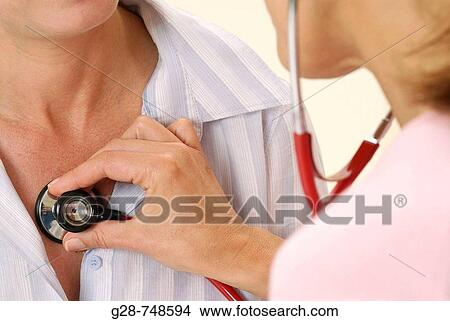 Doctor auscultating patient View Large Photo Image Picture - Doctor auscultating patient. Fotosearch