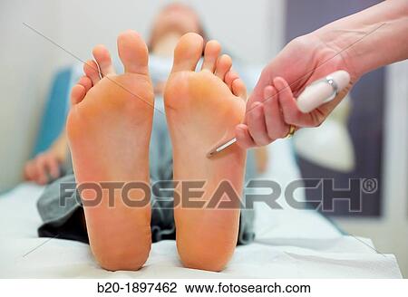 Doctor checking the Babinski plantar reflex, Physiotherapy medical center, Donostia, San Sebastian, Gipuzkoa, Basque Country, Spain View Large Photo Image Stock Image - Doctor checking the Babinski plantar reflex, Physiotherapy medical center, Donostia, San Sebastian, Gipuzkoa, Basque Country, Spain. Fotosearch