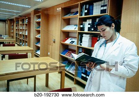 Doctor consulting book View Large Photo Image Stock Image - Doctor consulting book. Fotosearch