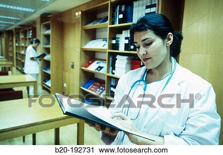 Doctor consulting book View Large Photo Image Stock Image - Doctor consulting book. Fotosearch