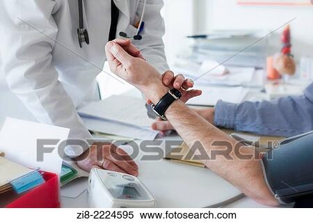 Doctor examines male patient. View Large Photo Image Stock Photography - Doctor examines male patient.. Fotosearch