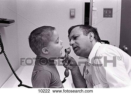 Doctor examining child with leukaemia View Large Photo Image Stock Image - Doctor examining child with leukaemia. Fotosearch