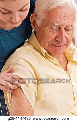 Doctor examining senior patient arm for skin problems View Large Photo Image Stock Photography - Doctor examining senior patient arm for skin problems. Fotosearch