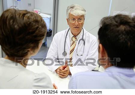 Picture - Doctor, family, Consulting room, Onkologikoa Hospital, Oncology Institute, Case Center for prevention, diagnosis and treatment of cancer, Donostia, San Sebastian, Gipuzkoa, Basque Country, Spain. Fotosearch