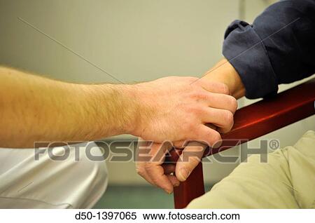 Doctor feeling the pulse of an elderly patient, Stockholm, Sweden View Large Photo Image Stock Photography - Doctor feeling the pulse of an elderly patient, Stockholm, Sweden. Fotosearch