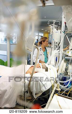 Stock Photo - Doctor, Resuscitation unit. Hospital Universitario de Gran Canaria Doctor Negrin, Las Palmas de Gran Canaria. Canary Islands, Spain. Fotosearch