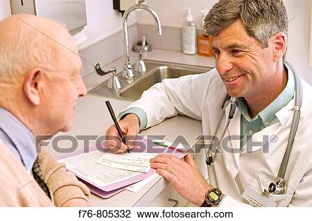 Doctor, reviewing and updating patient? s, medical records View Large Photo Image Stock Image - Doctor, reviewing and updating patient? s, medical records. Fotosearch
