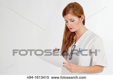 Doctor reviewing the results of a patient's medical information. View Large Photo Image Stock Photography - Doctor reviewing the results of a patient's medical information.. Fotosearch