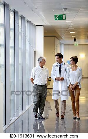 Doctor talking with the patient's family in the hospital corridor, Onkologikoa Hospital, Oncology Institute, Case Center for prevention, diagnosis and treatment of cancer, Donostia, San Sebastian, Gipuzkoa, Basque Country, Spain View Large Photo Image Stock Image - Doctor talking with the patient's family in the hospital corridor, Onkologikoa Hospital, Oncology Institute, Case Center for prevention, diagnosis and treatment of cancer, Donostia, San Sebastian, Gipuzkoa, Basque Country, Spain. Fotosearch