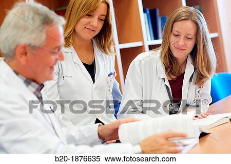 Doctor teaching medical students in library, Doctors in meeting room, Hospital Donostia, San Sebastian, Gipuzkoa, Basque Country, Spain View Large Photo Image Stock Photography - Doctor teaching medical students in library, Doctors in meeting room, Hospital Donostia, San Sebastian, Gipuzkoa, Basque Country, Spain. Fotosearch