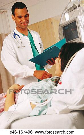 Doctor visiting patient View Large Photo Image Stock Photograph - Doctor visiting patient. Fotosearch