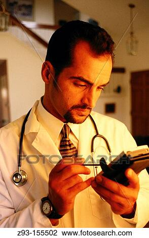 Stock Image - Doctor with palm pilot. Fotosearch