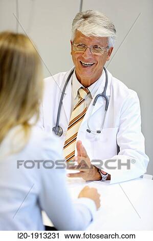 Doctor with patient, Consulting room, Onkologikoa Hospital, Oncology Institute, Case Center for prevention, diagnosis and treatment of cancer, Donostia, San Sebastian, Gipuzkoa, Basque Country, Spain View Large Photo Image Stock Image - Doctor with patient, Consulting room, Onkologikoa Hospital, Oncology Institute, Case Center for prevention, diagnosis and treatment of cancer, Donostia, San Sebastian, Gipuzkoa, Basque Country, Spain. Fotosearch