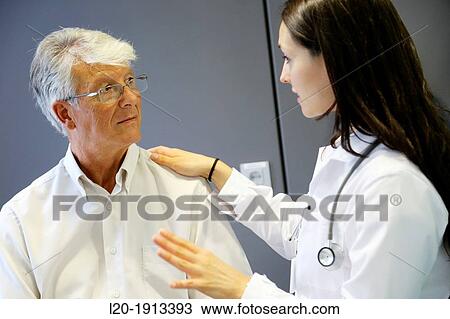 Stock Image - Doctor with patient, Consulting room, Onkologikoa Hospital, Oncology Institute, Case Center for prevention, diagnosis and treatment of cancer, Donostia, San Sebastian, Gipuzkoa, Basque Country, Spain. Fotosearch