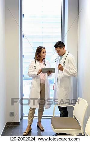 Doctor with patient in waiting room, Onkologikoa Hospital, Oncology Institute, Case Center for prevention, diagnosis and treatment of cancer, Donostia, San Sebastian, Gipuzkoa, Basque Country, Spain. View Large Photo Image Picture - Doctor with patient in waiting room, Onkologikoa Hospital, Oncology Institute, Case Center for prevention, diagnosis and treatment of cancer, Donostia, San Sebastian, Gipuzkoa, Basque Country, Spain.. Fotosearch