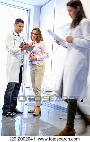 Doctor with patient in waiting room, Onkologikoa Hospital, Oncology Institute, Case Center for prevention, diagnosis and treatment of cancer, Donostia, San Sebastian, Gipuzkoa, Basque Country, Spain. View Large Photo Image Stock Image - Doctor with patient in waiting room, Onkologikoa Hospital, Oncology Institute, Case Center for prevention, diagnosis and treatment of cancer, Donostia, San Sebastian, Gipuzkoa, Basque Country, Spain.. Fotosearch