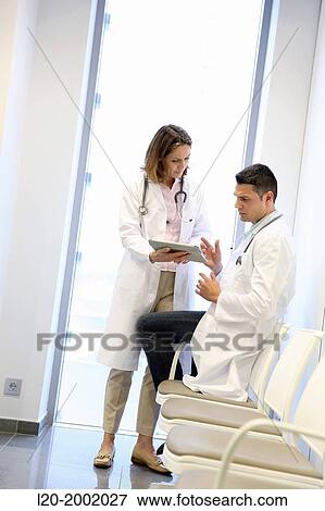 Doctor with patient in waiting room, Onkologikoa Hospital, Oncology Institute, Case Center for prevention, diagnosis and treatment of cancer, Donostia, San Sebastian, Gipuzkoa, Basque Country, Spain. View Large Photo Image Stock Photo - Doctor with patient in waiting room, Onkologikoa Hospital, Oncology Institute, Case Center for prevention, diagnosis and treatment of cancer, Donostia, San Sebastian, Gipuzkoa, Basque Country, Spain.. Fotosearch