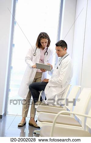 Doctor with patient in waiting room, Onkologikoa Hospital, Oncology Institute, Case Center for prevention, diagnosis and treatment of cancer, Donostia, San Sebastian, Gipuzkoa, Basque Country, Spain. View Large Photo Image Stock Photo - Doctor with patient in waiting room, Onkologikoa Hospital, Oncology Institute, Case Center for prevention, diagnosis and treatment of cancer, Donostia, San Sebastian, Gipuzkoa, Basque Country, Spain.. Fotosearch