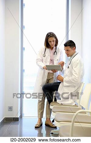 Doctor with patient in waiting room, Onkologikoa Hospital, Oncology Institute, Case Center for prevention, diagnosis and treatment of cancer, Donostia, San Sebastian, Gipuzkoa, Basque Country, Spain. View Large Photo Image Stock Photo - Doctor with patient in waiting room, Onkologikoa Hospital, Oncology Institute, Case Center for prevention, diagnosis and treatment of cancer, Donostia, San Sebastian, Gipuzkoa, Basque Country, Spain.. Fotosearch