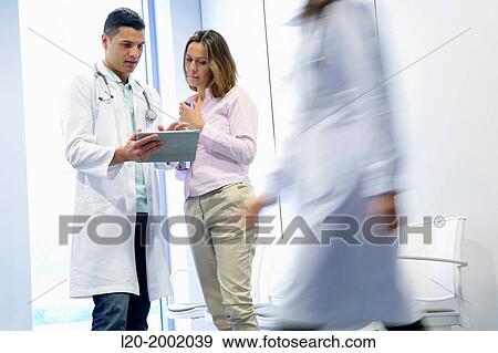 Doctor with patient in waiting room, Onkologikoa Hospital, Oncology Institute, Case Center for prevention, diagnosis and treatment of cancer, Donostia, San Sebastian, Gipuzkoa, Basque Country, Spain. View Large Photo Image Stock Photo - Doctor with patient in waiting room, Onkologikoa Hospital, Oncology Institute, Case Center for prevention, diagnosis and treatment of cancer, Donostia, San Sebastian, Gipuzkoa, Basque Country, Spain.. Fotosearch