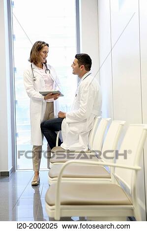 Doctor with patient in waiting room, Onkologikoa Hospital, Oncology Institute, Case Center for prevention, diagnosis and treatment of cancer, Donostia, San Sebastian, Gipuzkoa, Basque Country, Spain. View Large Photo Image Stock Photography - Doctor with patient in waiting room, Onkologikoa Hospital, Oncology Institute, Case Center for prevention, diagnosis and treatment of cancer, Donostia, San Sebastian, Gipuzkoa, Basque Country, Spain.. Fotosearch