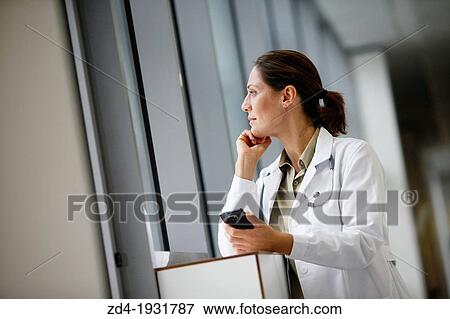 Doctor with smartphone in corridor, Onkologikoa Hospital, Oncology Institute, Case Center for prevention, diagnosis and treatment of cancer, Donostia, San Sebastian, Gipuzkoa, Basque Country, Spain View Large Photo Image Stock Photo - Doctor with smartphone in corridor, Onkologikoa Hospital, Oncology Institute, Case Center for prevention, diagnosis and treatment of cancer, Donostia, San Sebastian, Gipuzkoa, Basque Country, Spain. Fotosearch