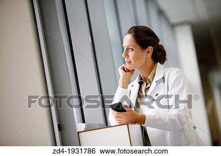 Doctor with smartphone in corridor, Onkologikoa Hospital, Oncology Institute, Case Center for prevention, diagnosis and treatment of cancer, Donostia, San Sebastian, Gipuzkoa, Basque Country, Spain View Large Photo Image Stock Photograph - Doctor with smartphone in corridor, Onkologikoa Hospital, Oncology Institute, Case Center for prevention, diagnosis and treatment of cancer, Donostia, San Sebastian, Gipuzkoa, Basque Country, Spain. Fotosearch