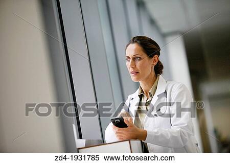 Doctor with smartphone in corridor, Onkologikoa Hospital, Oncology Institute, Case Center for prevention, diagnosis and treatment of cancer, Donostia, San Sebastian, Gipuzkoa, Basque Country, Spain View Large Photo Image Stock Photography - Doctor with smartphone in corridor, Onkologikoa Hospital, Oncology Institute, Case Center for prevention, diagnosis and treatment of cancer, Donostia, San Sebastian, Gipuzkoa, Basque Country, Spain. Fotosearch