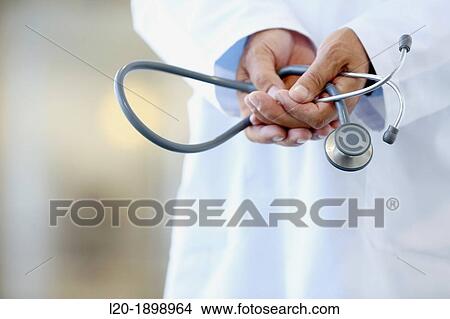 Doctor with stethoscope in corridor, Onkologikoa Hospital, Oncology Institute, Case Center for prevention, diagnosis and treatment of cancer, Donostia, San Sebastian, Gipuzkoa, Basque Country, Spain View Large Photo Image Picture - Doctor with stethoscope in corridor, Onkologikoa Hospital, Oncology Institute, Case Center for prevention, diagnosis and treatment of cancer, Donostia, San Sebastian, Gipuzkoa, Basque Country, Spain. Fotosearch