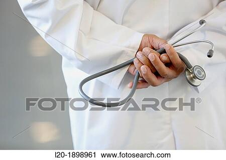 Stock Image - Doctor with stethoscope in corridor, Onkologikoa Hospital, Oncology Institute, Case Center for prevention, diagnosis and treatment of cancer, Donostia, San Sebastian, Gipuzkoa, Basque Country, Spain. Fotosearch