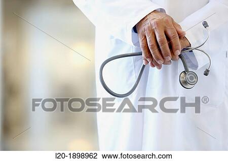 Doctor with stethoscope in corridor, Onkologikoa Hospital, Oncology Institute, Case Center for prevention, diagnosis and treatment of cancer, Donostia, San Sebastian, Gipuzkoa, Basque Country, Spain View Large Photo Image Stock Image - Doctor with stethoscope in corridor, Onkologikoa Hospital, Oncology Institute, Case Center for prevention, diagnosis and treatment of cancer, Donostia, San Sebastian, Gipuzkoa, Basque Country, Spain. Fotosearch