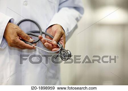 Doctor with stethoscope in corridor, Onkologikoa Hospital, Oncology Institute, Case Center for prevention, diagnosis and treatment of cancer, Donostia, San Sebastian, Gipuzkoa, Basque Country, Spain View Large Photo Image Stock Photo - Doctor with stethoscope in corridor, Onkologikoa Hospital, Oncology Institute, Case Center for prevention, diagnosis and treatment of cancer, Donostia, San Sebastian, Gipuzkoa, Basque Country, Spain. Fotosearch