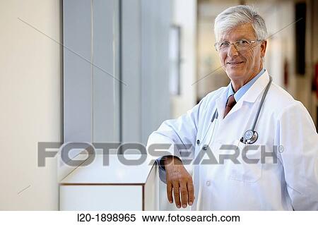 Stock Photography - Doctor with stethoscope in corridor, Onkologikoa Hospital, Oncology Institute, Case Center for prevention, diagnosis and treatment of cancer, Donostia, San Sebastian, Gipuzkoa, Basque Country, Spain. Fotosearch