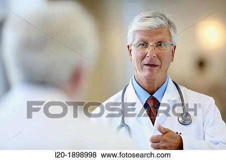 Doctor with stethoscope talking with patient, Onkologikoa Hospital, Oncology Institute, Case Center for prevention, diagnosis and treatment of cancer, Donostia, San Sebastian, Gipuzkoa, Basque Country, Spain View Large Photo Image Stock Photo - Doctor with stethoscope talking with patient, Onkologikoa Hospital, Oncology Institute, Case Center for prevention, diagnosis and treatment of cancer, Donostia, San Sebastian, Gipuzkoa, Basque Country, Spain. Fotosearch