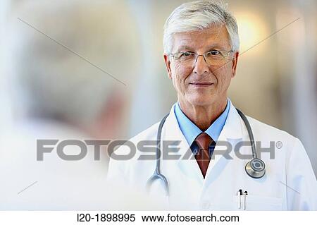 Doctor with stethoscope talking with patient, Onkologikoa Hospital, Oncology Institute, Case Center for prevention, diagnosis and treatment of cancer, Donostia, San Sebastian, Gipuzkoa, Basque Country, Spain View Large Photo Image Stock Photography - Doctor with stethoscope talking with patient, Onkologikoa Hospital, Oncology Institute, Case Center for prevention, diagnosis and treatment of cancer, Donostia, San Sebastian, Gipuzkoa, Basque Country, Spain. Fotosearch