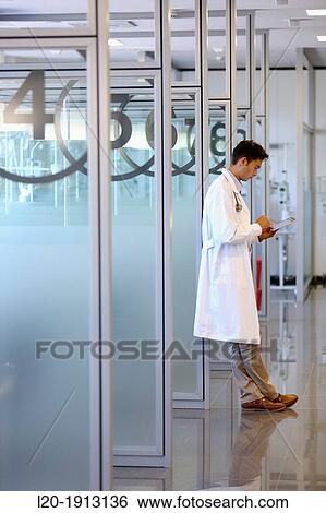 Stock Photograph - Doctor with tablet, Box chemotherapy, Onkologikoa Hospital, Oncology Institute, Case Center for prevention, diagnosis and treatment of cancer, Donostia, San Sebastian, Gipuzkoa, Basque Country, Spain. Fotosearch