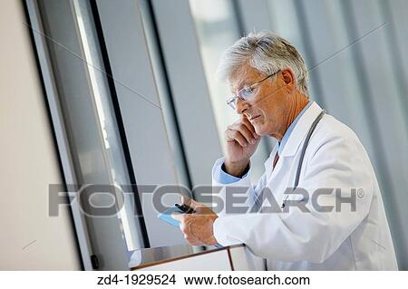 Doctor with tablet in corridor, Onkologikoa Hospital, Oncology Institute, Case Center for prevention, diagnosis and treatment of cancer, Donostia, San Sebastian, Gipuzkoa, Basque Country, Spain View Large Photo Image Picture - Doctor with tablet in corridor, Onkologikoa Hospital, Oncology Institute, Case Center for prevention, diagnosis and treatment of cancer, Donostia, San Sebastian, Gipuzkoa, Basque Country, Spain. Fotosearch