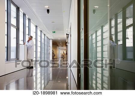 Doctor with tablet in corridor, Onkologikoa Hospital, Oncology Institute, Case Center for prevention, diagnosis and treatment of cancer, Donostia, San Sebastian, Gipuzkoa, Basque Country, Spain View Large Photo Image Stock Image - Doctor with tablet in corridor, Onkologikoa Hospital, Oncology Institute, Case Center for prevention, diagnosis and treatment of cancer, Donostia, San Sebastian, Gipuzkoa, Basque Country, Spain. Fotosearch