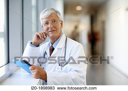 Doctor with tablet in corridor, Onkologikoa Hospital, Oncology Institute, Case Center for prevention, diagnosis and treatment of cancer, Donostia, San Sebastian, Gipuzkoa, Basque Country, Spain View Large Photo Image Stock Image - Doctor with tablet in corridor, Onkologikoa Hospital, Oncology Institute, Case Center for prevention, diagnosis and treatment of cancer, Donostia, San Sebastian, Gipuzkoa, Basque Country, Spain. Fotosearch