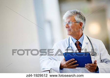 Doctor with tablet in corridor, Onkologikoa Hospital, Oncology Institute, Case Center for prevention, diagnosis and treatment of cancer, Donostia, San Sebastian, Gipuzkoa, Basque Country, Spain View Large Photo Image Stock Image - Doctor with tablet in corridor, Onkologikoa Hospital, Oncology Institute, Case Center for prevention, diagnosis and treatment of cancer, Donostia, San Sebastian, Gipuzkoa, Basque Country, Spain. Fotosearch