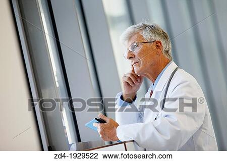 Doctor with tablet in corridor, Onkologikoa Hospital, Oncology Institute, Case Center for prevention, diagnosis and treatment of cancer, Donostia, San Sebastian, Gipuzkoa, Basque Country, Spain View Large Photo Image Stock Image - Doctor with tablet in corridor, Onkologikoa Hospital, Oncology Institute, Case Center for prevention, diagnosis and treatment of cancer, Donostia, San Sebastian, Gipuzkoa, Basque Country, Spain. Fotosearch