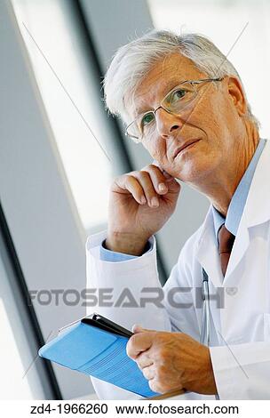 Doctor with tablet in corridor, Onkologikoa Hospital, Oncology Institute, Case Center for prevention, diagnosis and treatment of cancer, Donostia, San Sebastian, Gipuzkoa, Basque Country, Spain View Large Photo Image Stock Image - Doctor with tablet in corridor, Onkologikoa Hospital, Oncology Institute, Case Center for prevention, diagnosis and treatment of cancer, Donostia, San Sebastian, Gipuzkoa, Basque Country, Spain. Fotosearch
