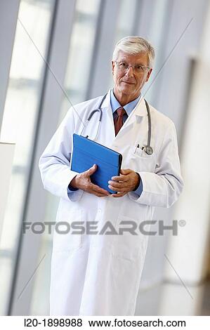 Doctor with tablet in corridor, Onkologikoa Hospital, Oncology Institute, Case Center for prevention, diagnosis and treatment of cancer, Donostia, San Sebastian, Gipuzkoa, Basque Country, Spain View Large Photo Image Stock Photo - Doctor with tablet in corridor, Onkologikoa Hospital, Oncology Institute, Case Center for prevention, diagnosis and treatment of cancer, Donostia, San Sebastian, Gipuzkoa, Basque Country, Spain. Fotosearch