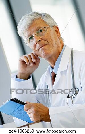 Doctor with tablet in corridor, Onkologikoa Hospital, Oncology Institute, Case Center for prevention, diagnosis and treatment of cancer, Donostia, San Sebastian, Gipuzkoa, Basque Country, Spain View Large Photo Image Stock Photo - Doctor with tablet in corridor, Onkologikoa Hospital, Oncology Institute, Case Center for prevention, diagnosis and treatment of cancer, Donostia, San Sebastian, Gipuzkoa, Basque Country, Spain. Fotosearch